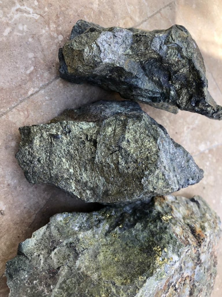  Rough lead-zinc ore samples displaying a metallic luster and rugged texture, representing industrial minerals sourced by Bare Syndicate
