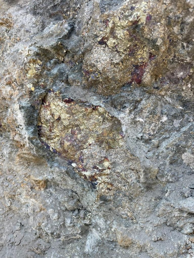 Close-up view of copper-rich ore at the Paikhel Copper Deposit, showcasing the visible mineral veins that highlight the high-quality copper content in this significant deposit.
