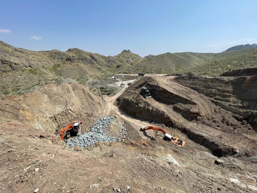 Aerial view of mining operations at the Paikhel Copper Deposit, highlighting the excavation and potential of this significant copper resource.