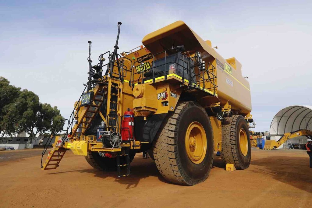 Autonomous Caterpillar haul truck used in mining operations, showcasing its massive size and advanced technology.