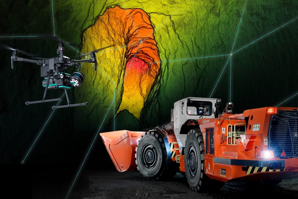 Drone and automated mining truck operating underground with a 3D scan of the mine wall.